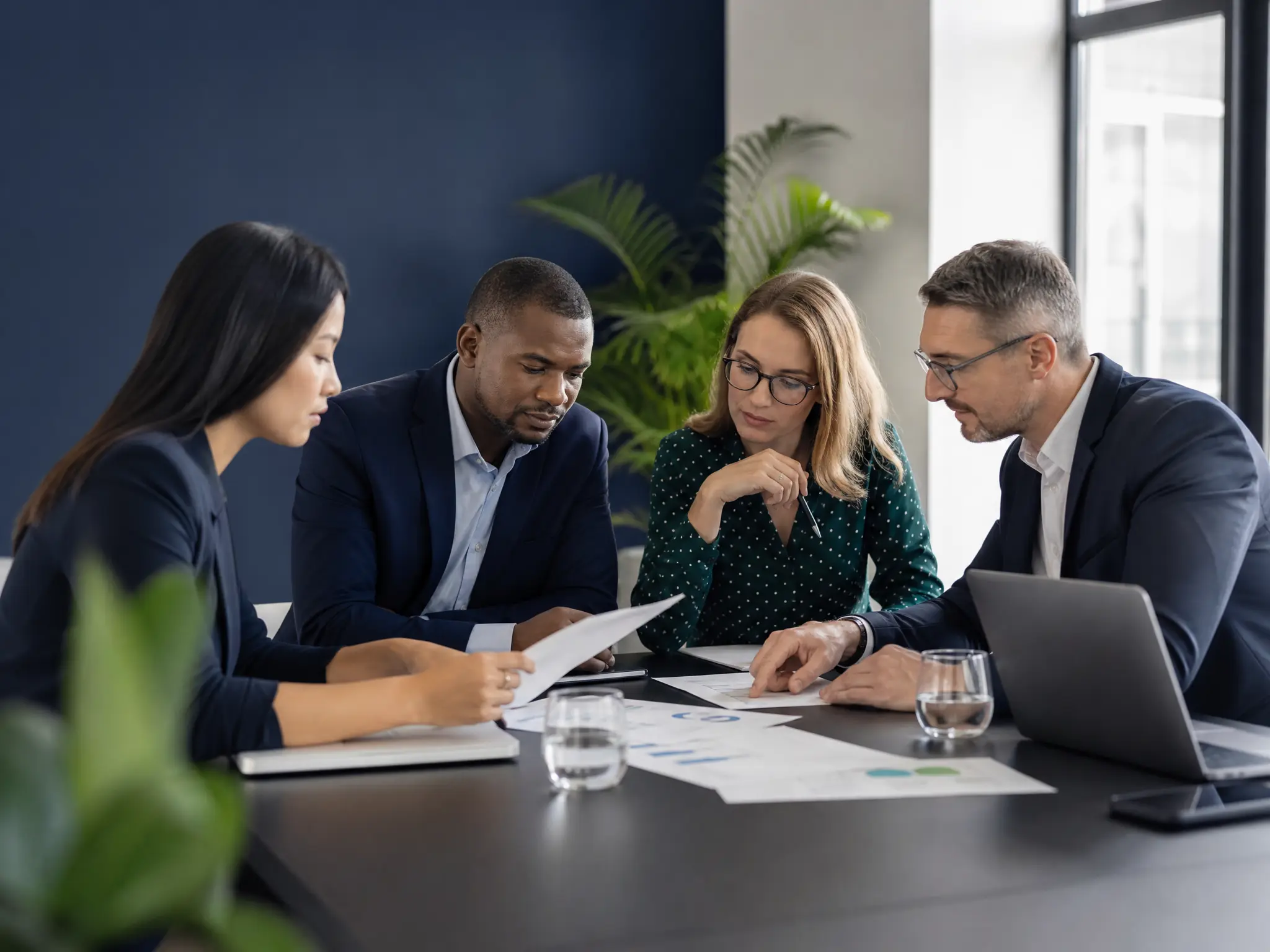 Business consulting team reviewing strategy documents